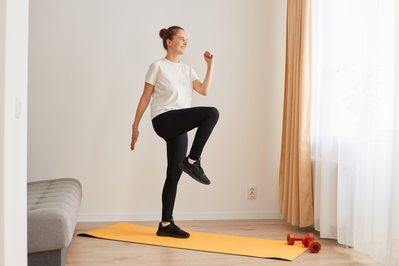 woman exercising in her home